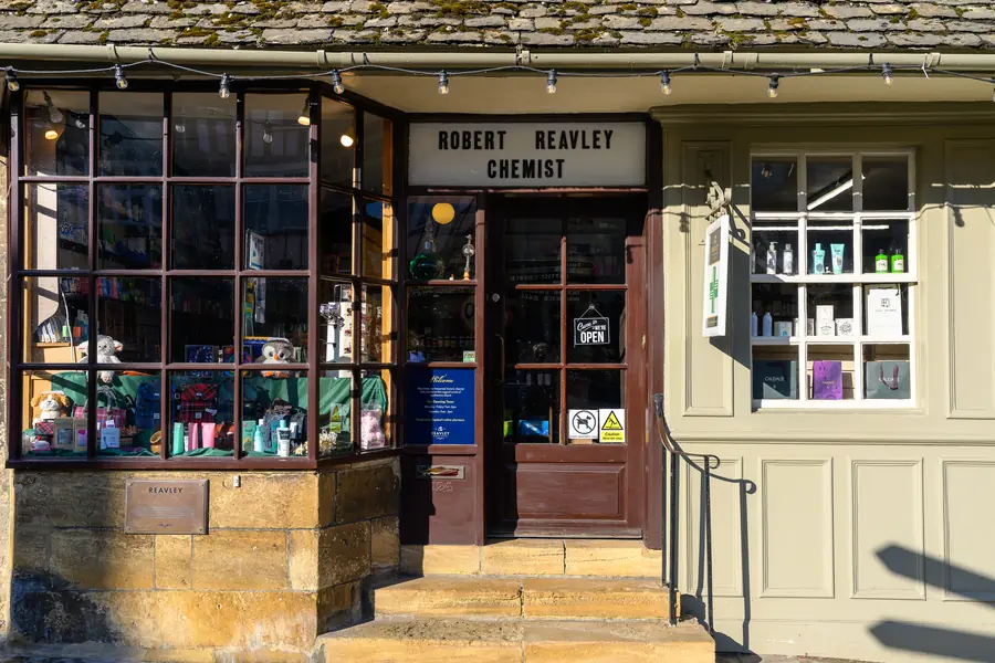 Robert Reavley Chemist, a traditional shopfront on Burford High Street